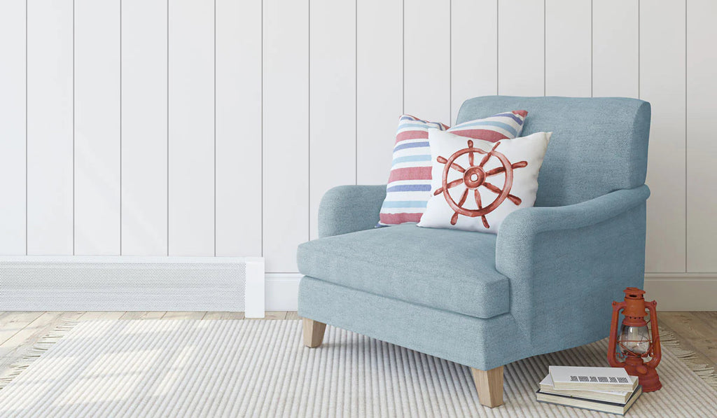 Coastal style sitting area with white walls, baseboard heater, and blue armchair.