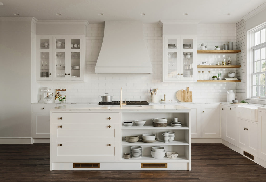 White kitchen island with two toe kick registers at the base.