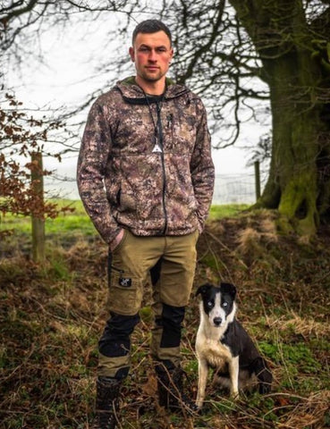 Man Using a Sheepdog Whistle