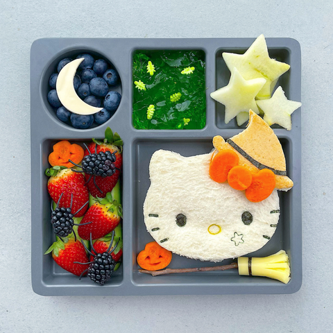Strawberries, blueberries and a Hello Kitty shaped sandwich on our divided plates