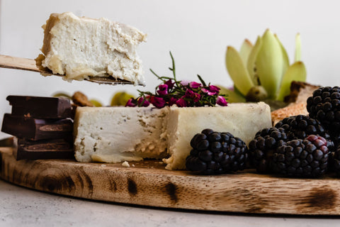 Plantbased cheese cut into on a beautiful cheese board