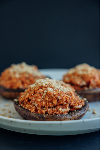 Close up of stuffed portobello mushrooms with walnut parmesan