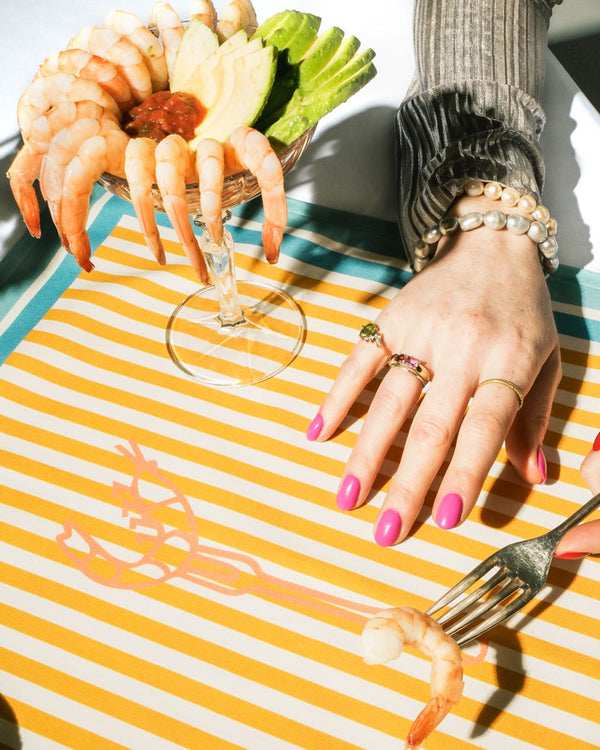 It's a " PRAWN ON A FORK" napkin