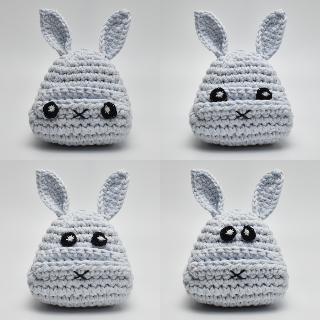 Different positions of eyes on crochet bunny mobile stand