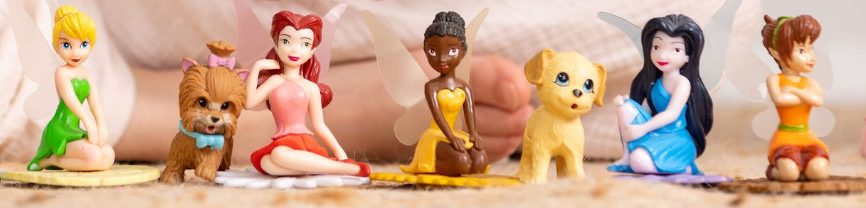 Disney fairies miniature dolls are lines up on the floor