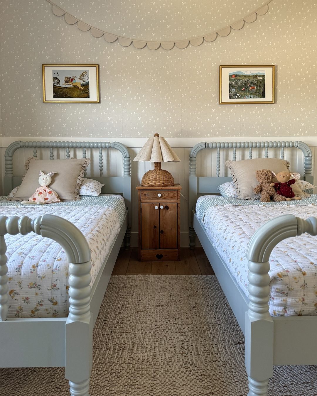 Two light blue vintage twin beds.