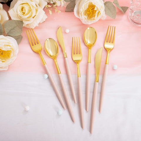 gold plastic utensils with pink handles