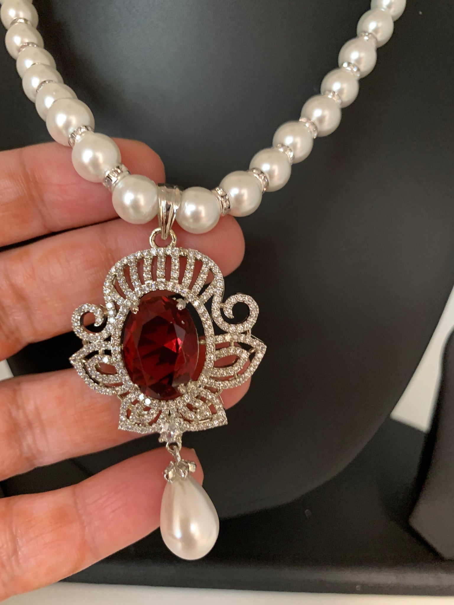 pearl necklace with red stone