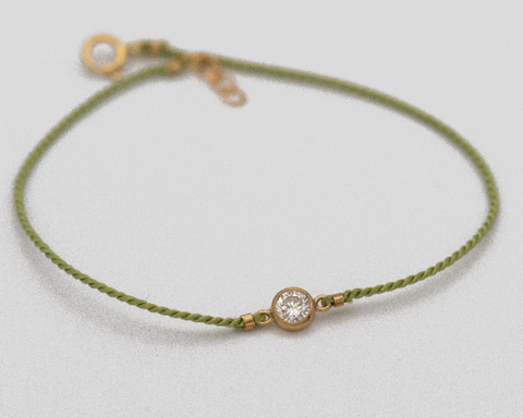 dainty cz solitaire on silk cord string green