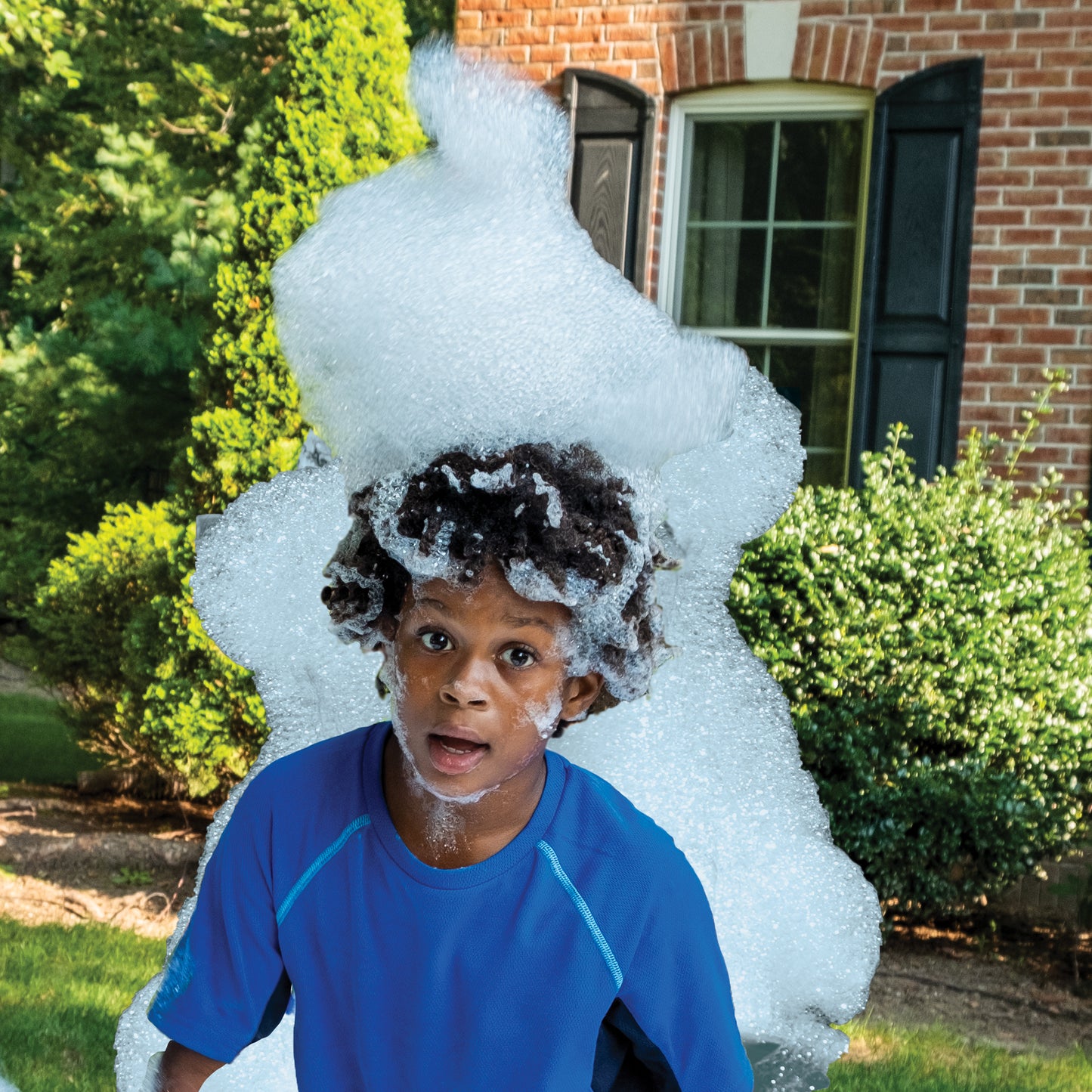 Fun with foam. Young boy with a pile of Fom Mania foam on his head.