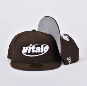 brown and white fitted cap