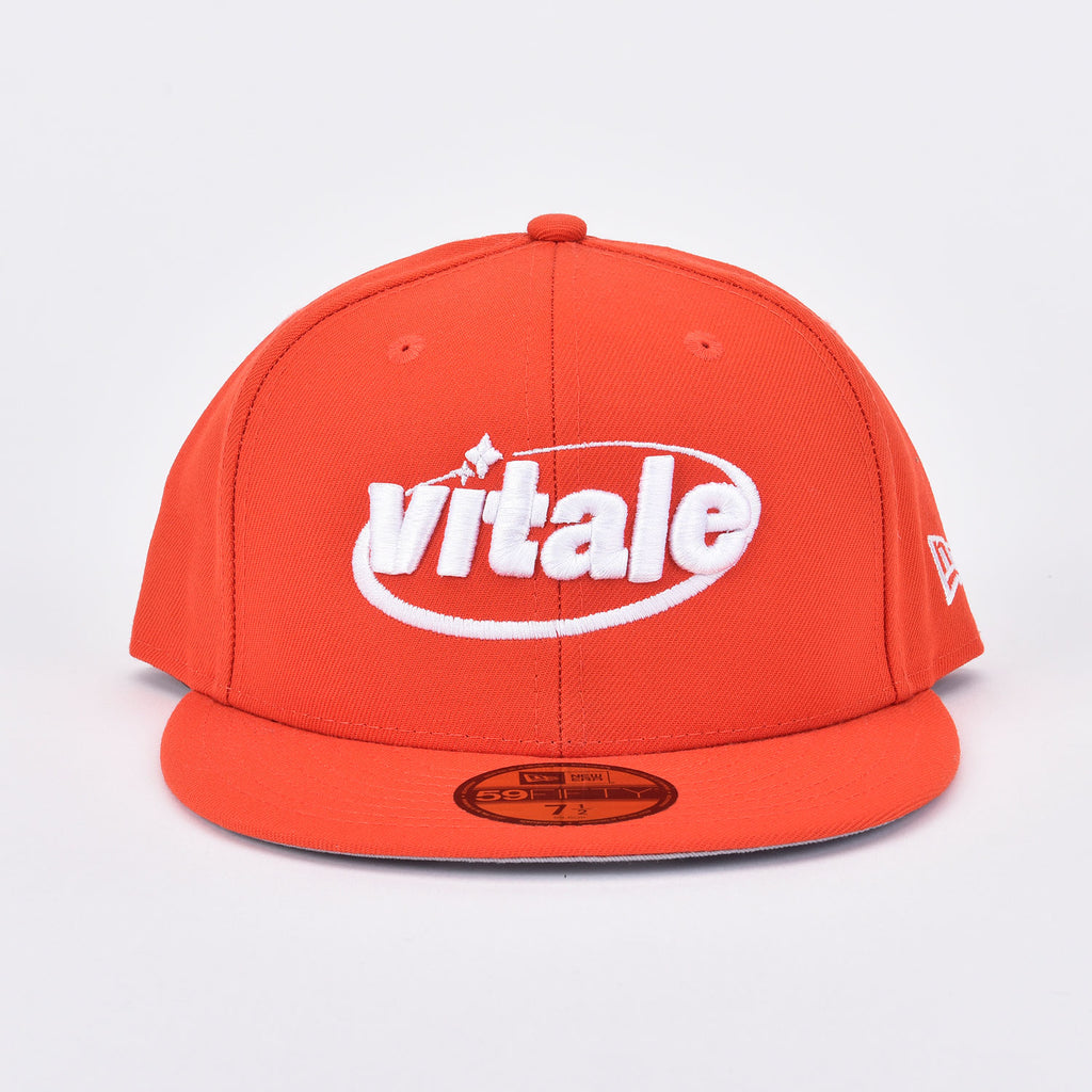 orange and white new era hat