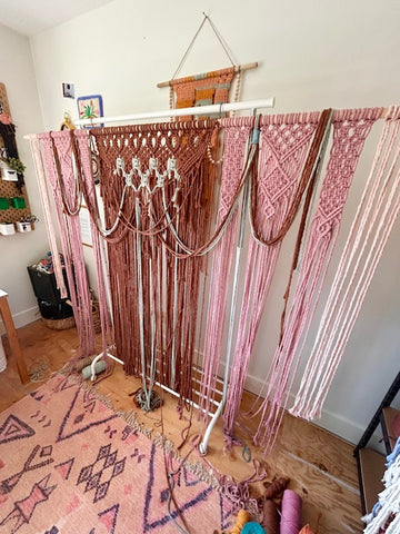 fibre art studio with a brown and pink piece being created
