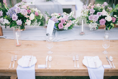 Table with table runner and floral arrangements