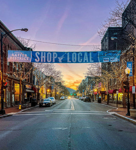 Evening view of Market Street Corning NY with Shop Local banner across Centerway Square