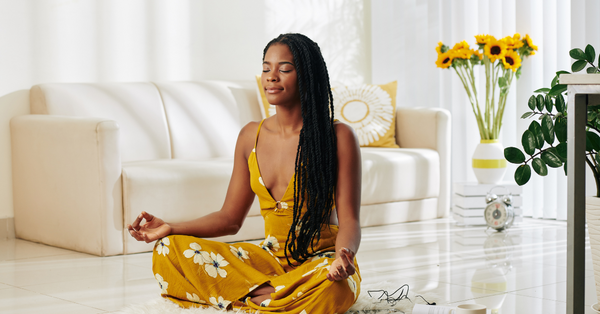 Black woman meditating.