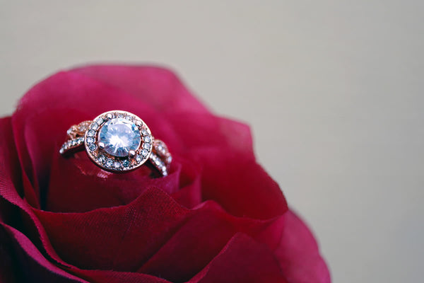 gold ring with diamonds on the rose flower