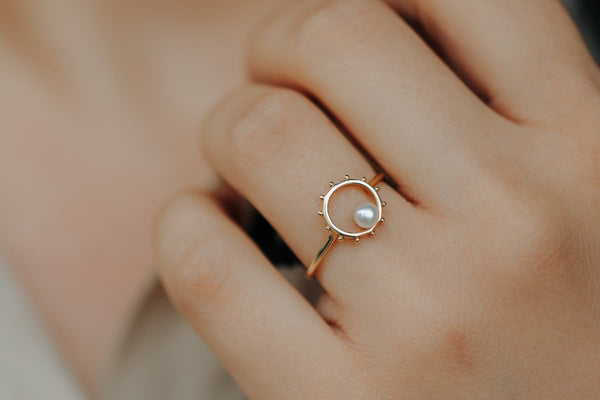 Gold stackable ring on women hand