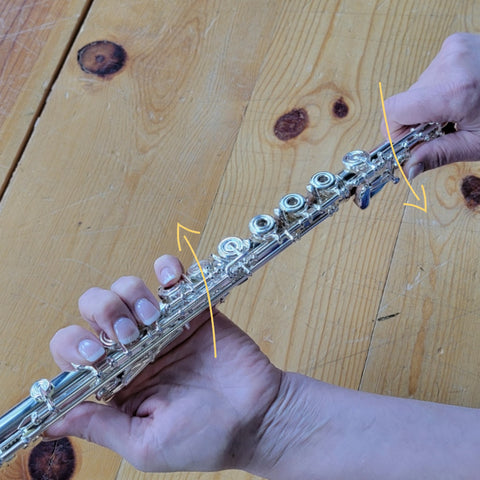 A flute being disassembled properly with a gentle twisting motion