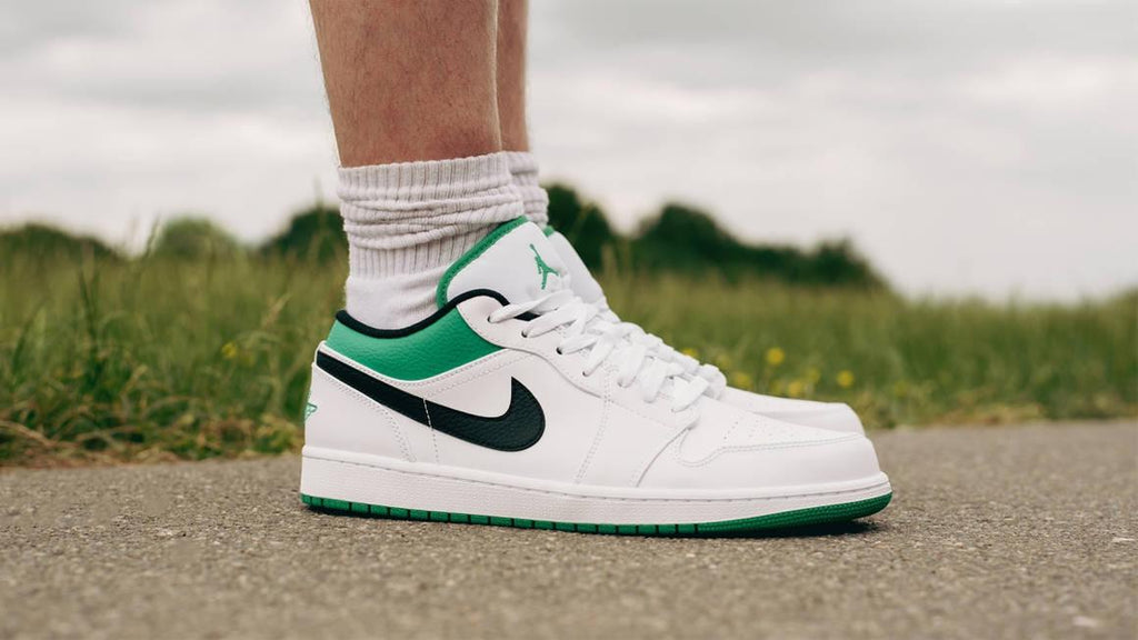 green and white low top jordans