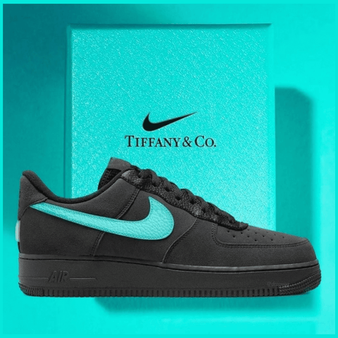 Close-up of the Nike Air Force 1 Tiffany Sneaker showing the clean black leather upper, metallic silver accents, and signature Tiffany blue color