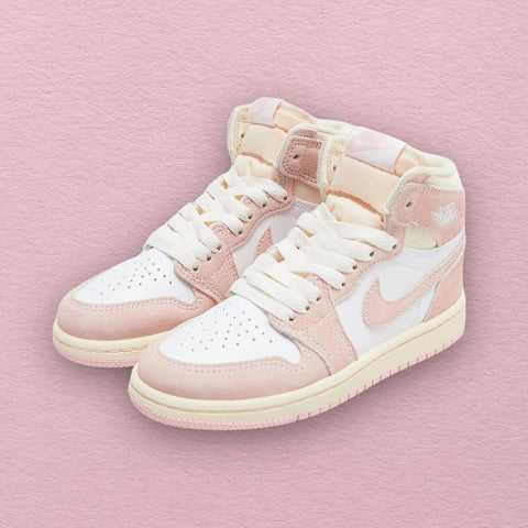 Nike Air Jordan 1 Retro High OG 'Washed Pink' Women Sneaker with soft pink leather upper, white accents on the Swoosh, laces, and midsole, and a Nike Air tongue tag.