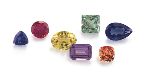 a selection of sapphire gemstones in a rainbow of colors