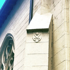 Scissors carved into the facade of Eglise Saint-Bonaventure, in Lyons, France