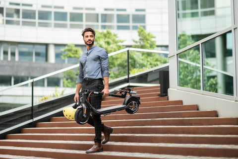 Men in a suit with Segway-Ninebot Kickscooter F-30