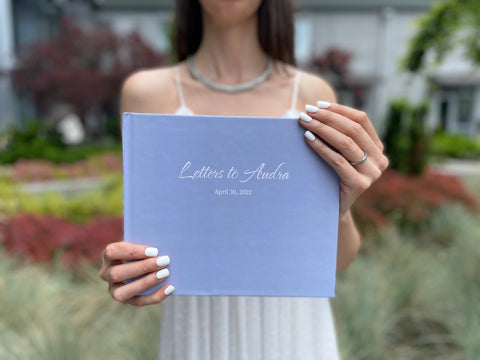 Bride holding Letters to the Bride book
