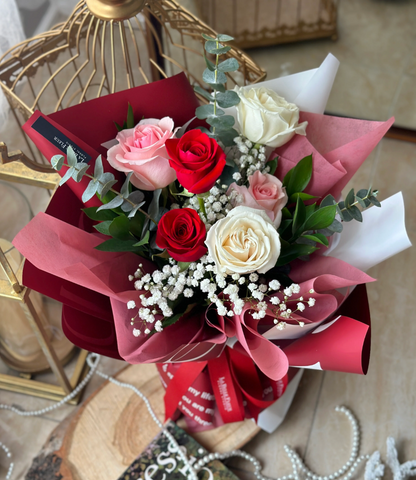 White, pink, and red rose bouquet