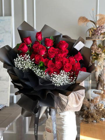50 red roses bouquet with baby's breath