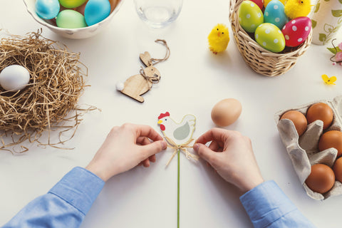 Hands making easter crafts