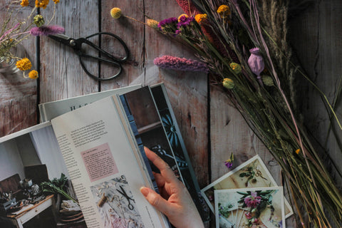 Dried flowers next to magazine