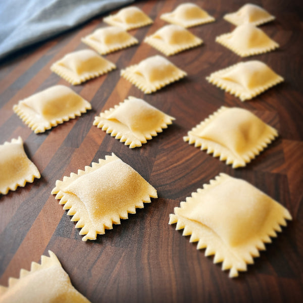 Agnolotti filled pasta shapes made with fresh pasta dough
