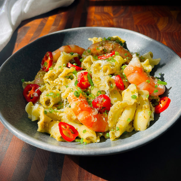 Pesto pasta with tiger prawns and fresh chilli