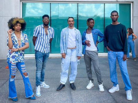 A group of male models pose together.