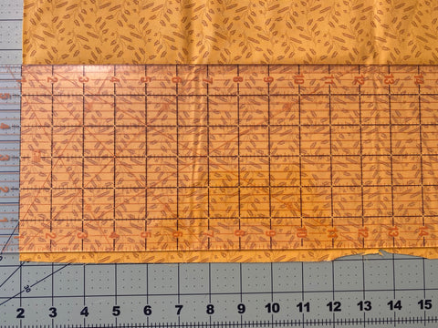 line up one of the inch markings of my ruler with the folded edge of the fabric