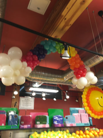 Hanging rainbow garland with clouds