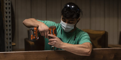 CMS team member working on live edge dining table