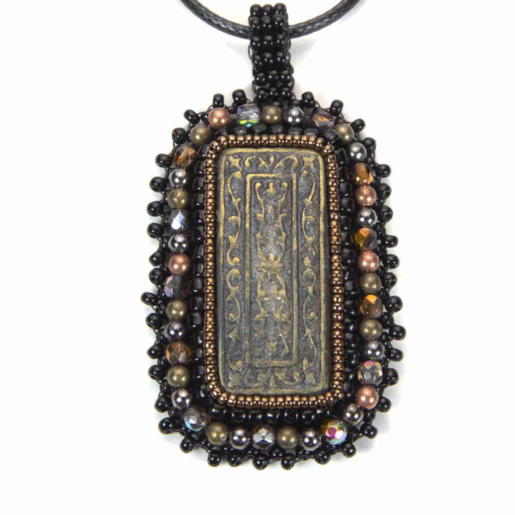 black and bronze rectangular pendant with awesome awesome polymer clay black beaded fringe