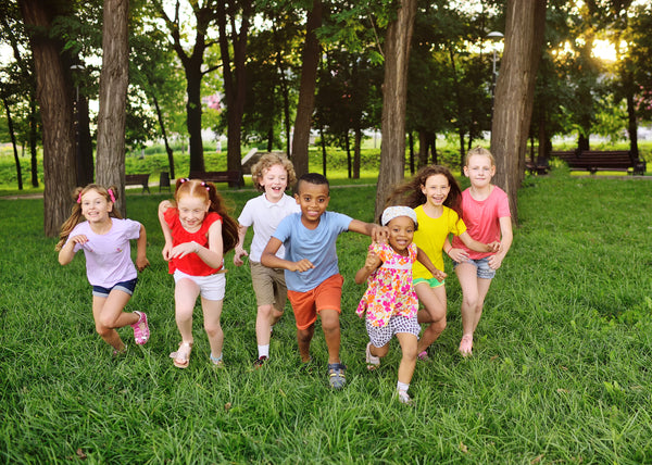 Family need - Machrus a-group-of-preschoolers-running-on-the-grass