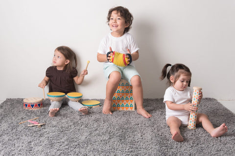 Group of children playing with different musical instruments