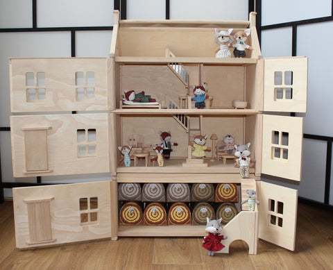 A collection of small plush foxes inside a dollhouse