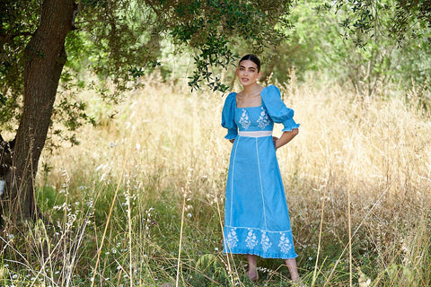 landscape portrait on woman in blue dress