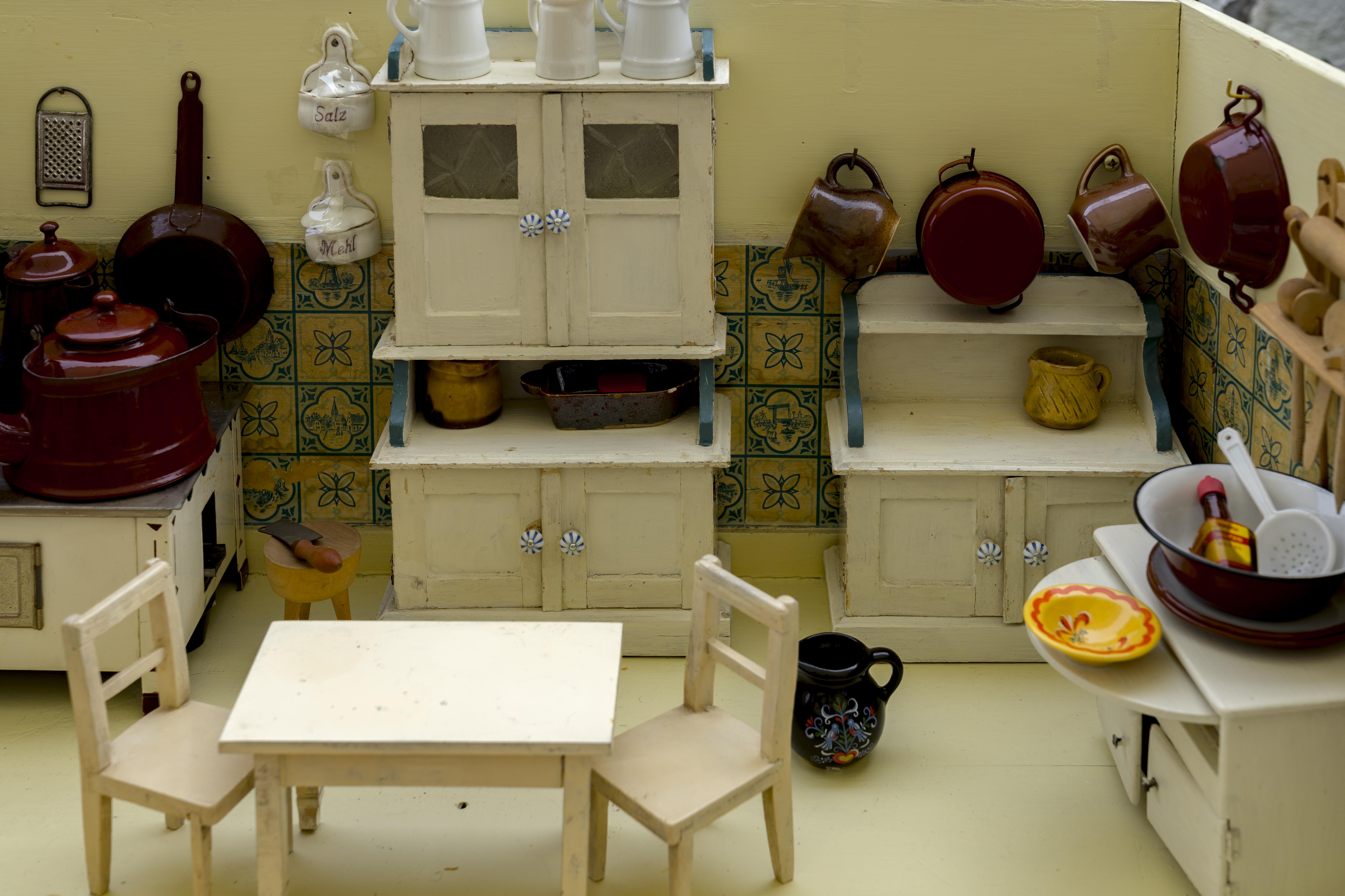 Tiny model kitchen. Classic beige cabinets with portuguese tiles for the backsplash. 