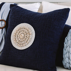 Navy blue cushion with shell accents