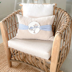 Natural colour coastal cushion with palm trees and blue and white stripes. Coastal cushion for a coastal home