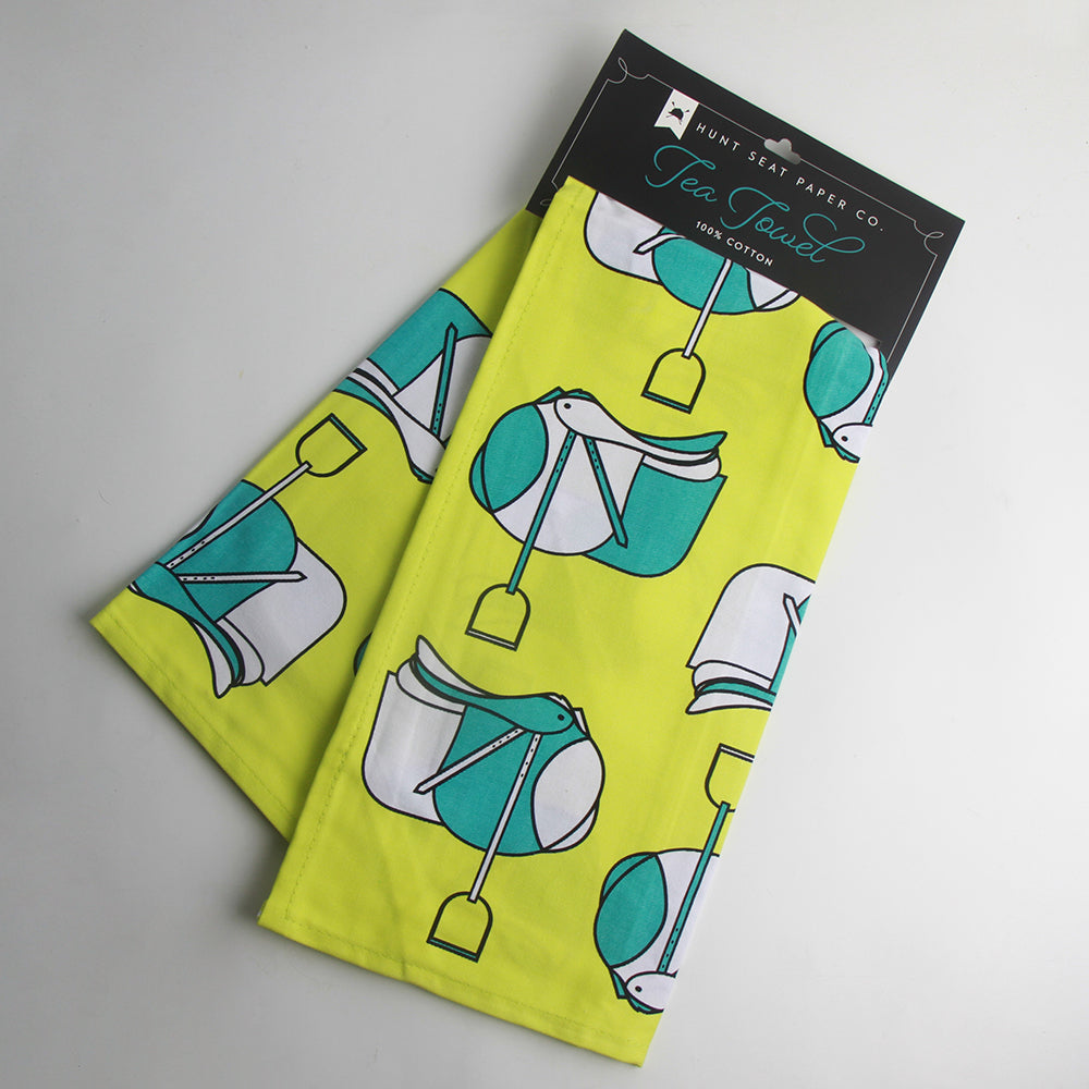 Horse-themed tea towel with jump saddles in a pop art pattern