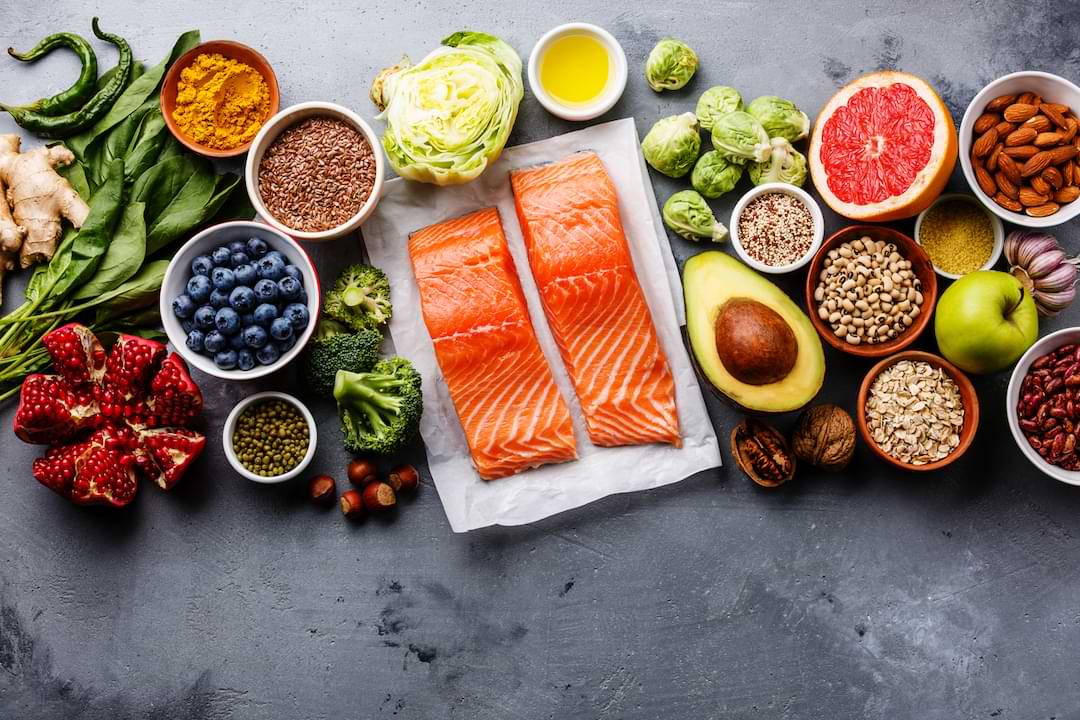 A wide array of different collagen-rich foods, like salmon, berries, greens, nuts, and legumes